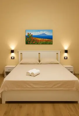Letto o letti in una camera di Etna Charme Guest House