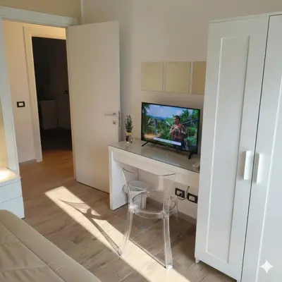TV o dispositivi per l'intrattenimento presso Etna Charme Guest House