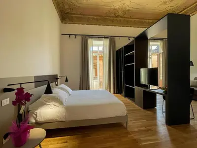 Letto o letti in una camera di Tambasia rooms, Centro storico,Via Etnea