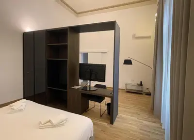 Letto o letti in una camera di Tambasia rooms, Centro storico,Via Etnea