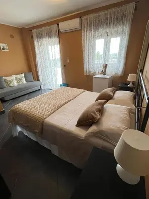 Letto o letti in una camera di B&B Terrazza dell'Etna