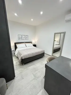 Letto o letti in una camera di Mongibello Apartment