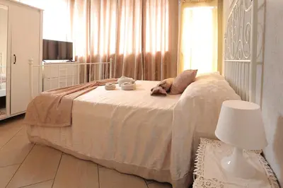 Letto o letti in una camera di U Casteddu Home Motta Sant'Anastasia 1