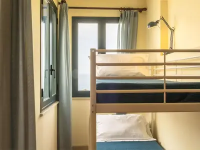Letto o letti in una camera di Apartment Wohnung in Riposto mit Terrasse by Interhome