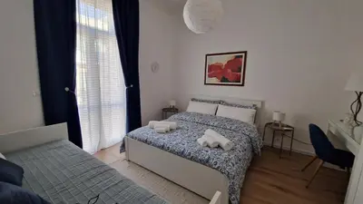 Letto o letti in una camera di Aosta apartment, to always feel at home
