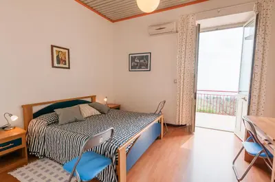 Letto o letti in una camera di Al Villino Sunshine appartamento in villa con piscina
