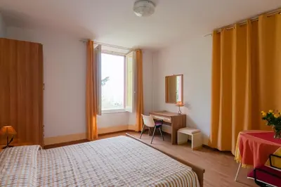Letto o letti in una camera di Al Villino Sunshine appartamento in villa con piscina