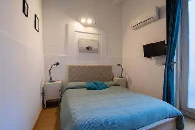 Letto o letti in una camera di Catania City Rooms