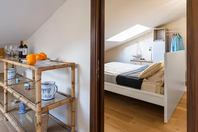 Letto o letti in una camera di Il Nido Vista Mare - Mansarda panoramica