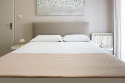 Letto o letti in una camera di Luminoso Appartamento Vista Mare sul Lungomare