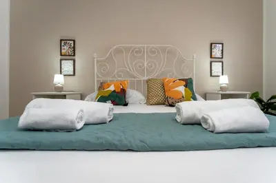 Letto o letti in una camera di appartamento condorelli