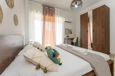 Letto o letti in una camera di appartamento condorelli