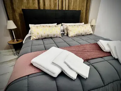 Letto o letti in una camera di Exclusive and reserved suite, secure parking