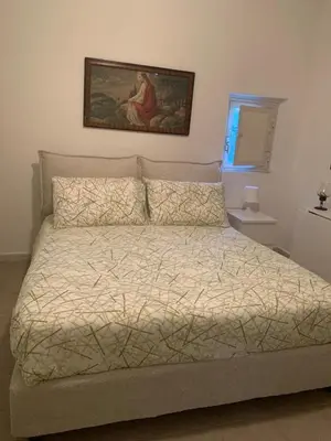 Letto o letti in una camera di Casa dei Gigli relax and vacation among flowers and fruits