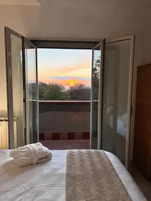 Letto o letti in una camera di Villa Edmondo