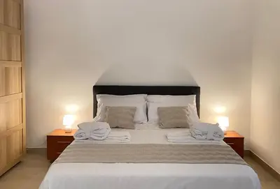 Letto o letti in una camera di Villa Edmondo