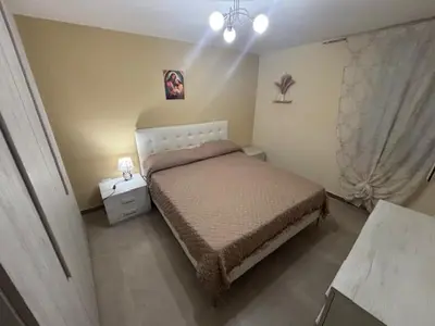 Letto o letti in una camera di Donna Tina