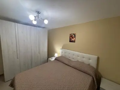 Letto o letti in una camera di Donna Tina