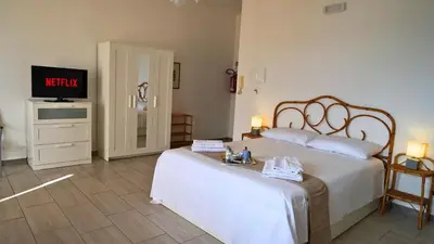 Letto o letti in una camera di Faraglioni Sea Terrace