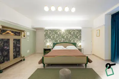 Letto o letti in una camera di Hotiday Catania Stanze Letterarie