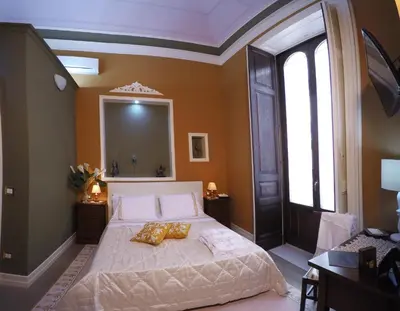 Letto o letti in una camera di Art Fashion House Luxury Rooms