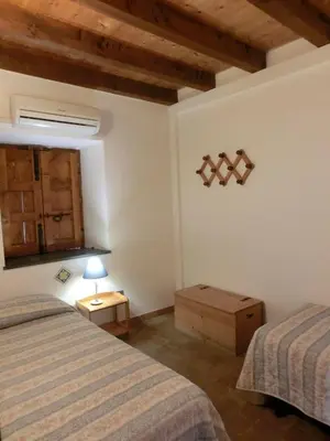 Letto o letti in una camera di Agriturismo Il Limoneto Acireale