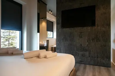 Letto o letti in una camera di Michelangelo Etna Hotel
