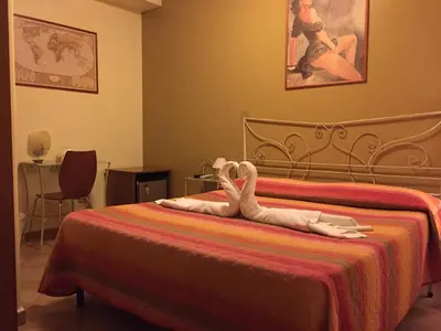 Letto o letti in una camera di B&B Epos Acitrezza