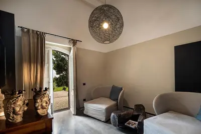 Area soggiorno di Donna Carmela Resort & Lodges