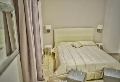 Letto o letti in una camera di B&B Lungomare