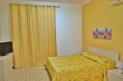 Letto o letti in una camera di B&B Lungomare