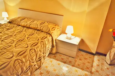 Letto o letti in una camera di B&B Lungomare