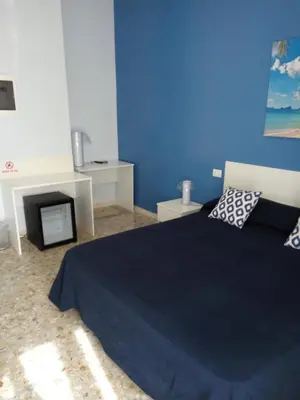 Letto o letti in una camera di Michelangelo Rooms