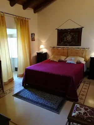 Letto o letti in una camera di B&B Palazzo Gambino