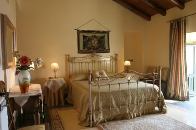 Letto o letti in una camera di B&B Palazzo Gambino