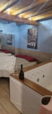 Letto o letti in una camera di B&B Mongibello