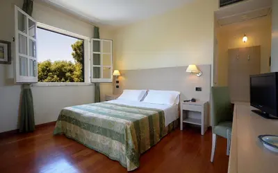 Letto o letti in una camera di Hotel Borgo Verde