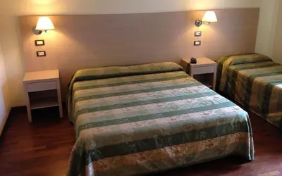 Letto o letti in una camera di Hotel Borgo Verde