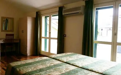 Letto o letti in una camera di Hotel Borgo Verde