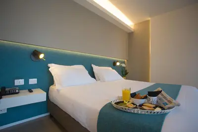 Letto o letti in una camera di Airone City Hotel