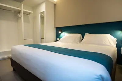 Letto o letti in una camera di Airone City Hotel