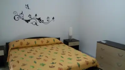 Letto o letti in una camera di Casa Trinacria
