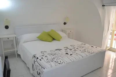 Letto o letti in una camera di Il Cortiletto Di Piazza Verga