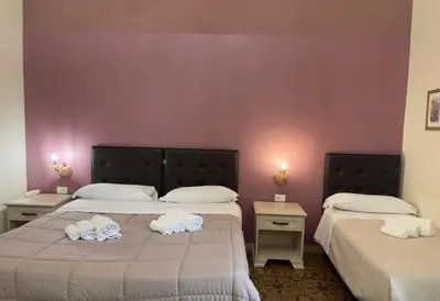 Letto o letti in una camera di Umberto House Catania