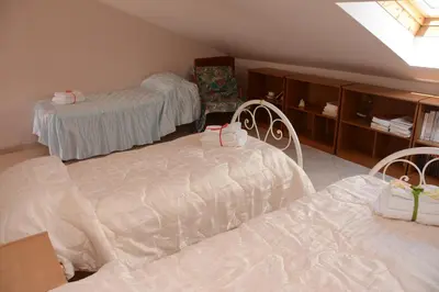 Letto o letti in una camera di B&B Villa San Leonardo