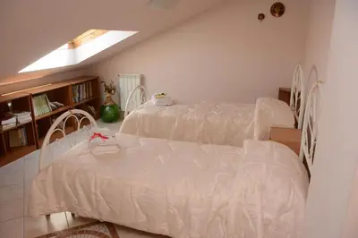 Letto o letti in una camera di B&B Villa San Leonardo