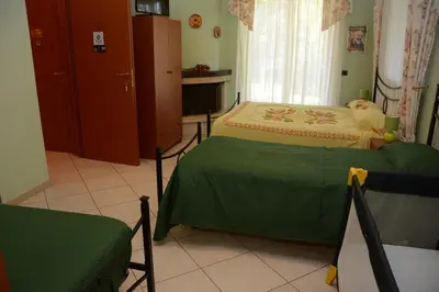 Letto o letti in una camera di B&B Villa San Leonardo