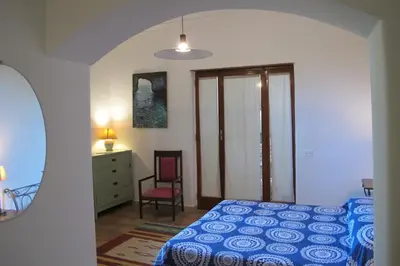 Letto o letti in una camera di Casa Amaryllis