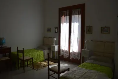 Letto o letti in una camera di B&B Vicolo del Chiostro