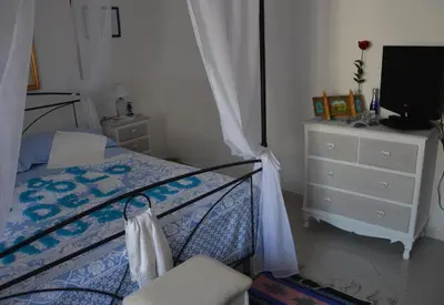 Letto o letti in una camera di B&B Vicolo del Chiostro